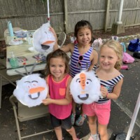 Campers showing their arts and crafts